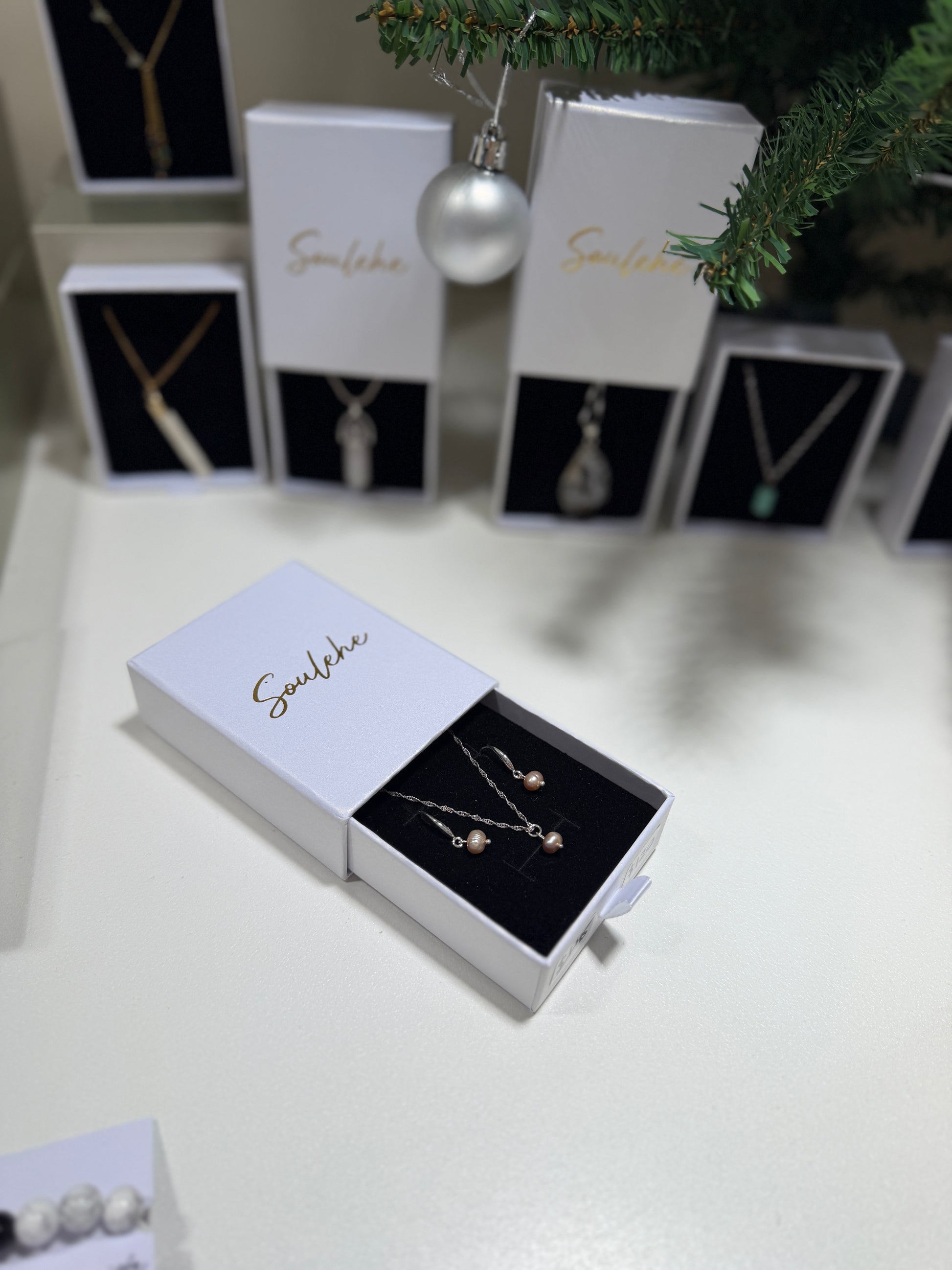 Pink pearl silver necklace with matching pink pearl earrings.