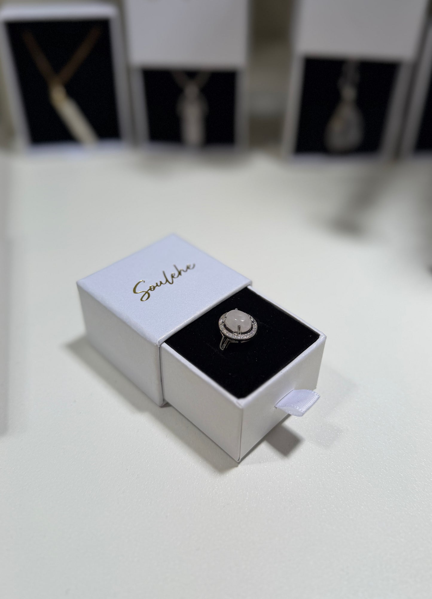 Jewelry box with a ring inside on a white surface