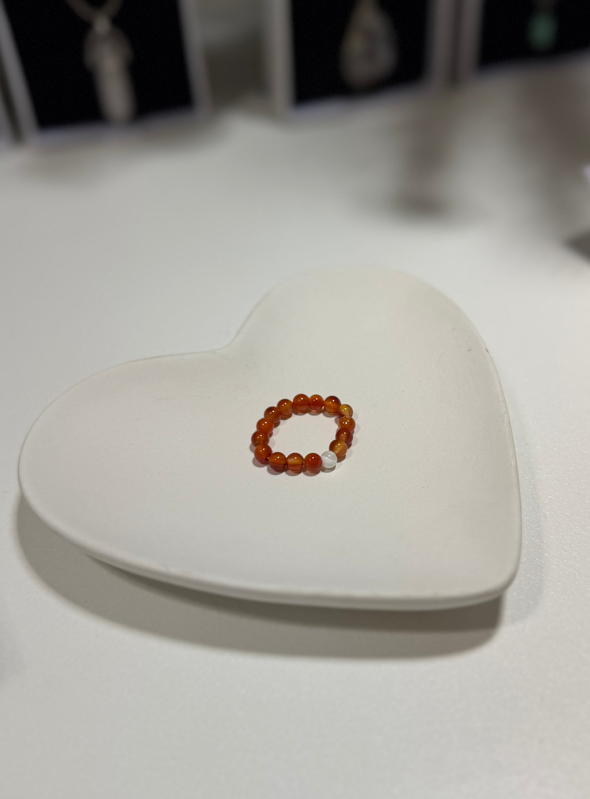 Small amber bracelet on a heart-shaped white stone
