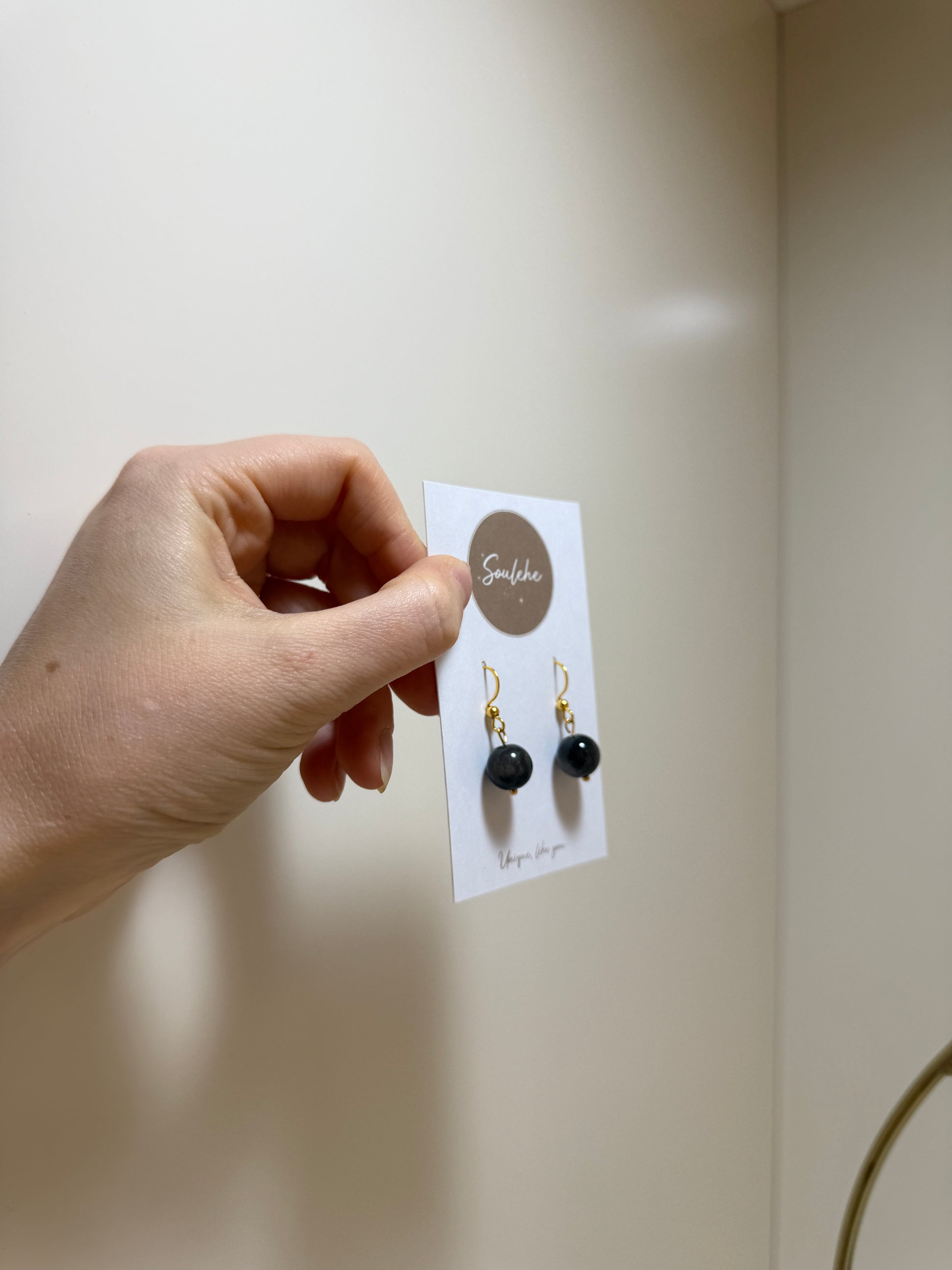 Gold hook earrings with Obsidian beads.